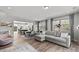 Spacious living area featuring open kitchen concept, hardwood floors, and modern decor at 3321 Treble Ct, Charlotte, NC 28262