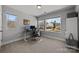 Office space featuring large windows and neutral decor at 3321 Treble Ct, Charlotte, NC 28262