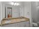 Bathroom features a double sink vanity with granite countertops, and mirrored cabinets at 3506 Cardiff Ln, Matthews, NC 28104