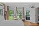 Cozy bedroom with natural light streaming through large bay windows, creating a peaceful and inviting atmosphere at 3506 Cardiff Ln, Matthews, NC 28104