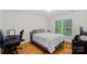 Bedroom featuring a cozy bed and a window, offering a serene and comfortable space for rest and relaxation at 3506 Cardiff Ln, Matthews, NC 28104