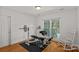 Workout room with weight bench and window at 3506 Cardiff Ln, Matthews, NC 28104