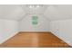 Bonus room with hardwood floors and natural light, offering a versatile space for recreation or relaxation at 3506 Cardiff Ln, Matthews, NC 28104