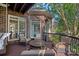 Outdoor deck featuring patio furniture, beautiful brick siding, a heater, and a backyard view at 3506 Cardiff Ln, Matthews, NC 28104