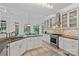 Bright kitchen features stone countertops, stainless steel appliances, and lots of natural light from large windows at 3506 Cardiff Ln, Matthews, NC 28104