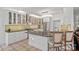 Well-appointed kitchen featuring stone countertops, stainless steel appliances, and a center island with seating at 3506 Cardiff Ln, Matthews, NC 28104