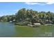 Aerial view of the property showcasing the lakeside location and private boat docks at 392 Stonemarker Rd, Mooresville, NC 28117