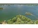 Expansive aerial view of the large, tranquil lake with surrounding lush greenery and some small islands at 392 Stonemarker Rd, Mooresville, NC 28117