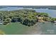 Aerial view of lush, green properties on a point and lakefront living at 392 Stonemarker Rd, Mooresville, NC 28117