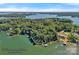 Aerial view of waterfront property surrounded by lush trees and pristine lake views; a serene, private oasis at 392 Stonemarker Rd, Mooresville, NC 28117