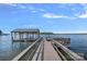 Lake house with a private dock and covered boat slip for easy access to water activities at 392 Stonemarker Rd, Mooresville, NC 28117