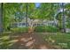 Charming lake house with a screened porch and natural landscaping for a private and peaceful setting at 392 Stonemarker Rd, Mooresville, NC 28117
