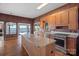 Spacious kitchen with an island, stainless steel appliances, and lake views from the large windows at 392 Stonemarker Rd, Mooresville, NC 28117