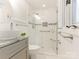 Bathroom featuring modern vanity, glass-enclosed shower and updated fixtures at 406 Wilcrest Dr, Matthews, NC 28105