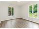 Bedroom with fresh paint, new flooring and windows overlooking the yard at 406 Wilcrest Dr, Matthews, NC 28105