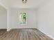 Open dining room featuring new laminate floors and neutral paint at 406 Wilcrest Dr, Matthews, NC 28105