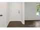 Clean entryway with neutral paint and laminate floors at 406 Wilcrest Dr, Matthews, NC 28105