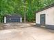Exterior view of a detached garage, playground, and pergola in the backyard at 406 Wilcrest Dr, Matthews, NC 28105