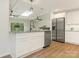 Beautiful kitchen island with stainless steel appliances and new countertops at 406 Wilcrest Dr, Matthews, NC 28105