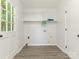 Laundry room with shelving, hookups, and a door to the outside at 406 Wilcrest Dr, Matthews, NC 28105