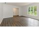 Bright living room featuring new laminate floors and neutral paint at 406 Wilcrest Dr, Matthews, NC 28105