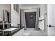 Modern bathroom features a shower-tub combination, stylish tile, and sleek fixtures at 407 Newstyle Way, Gastonia, NC 28056