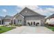 Charming brick home with manicured lawn and ample parking space at 407 Newstyle Way, Gastonia, NC 28056