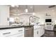 Modern kitchen with white cabinetry, stainless steel appliances, and farmhouse sink at 407 Newstyle Way, Gastonia, NC 28056