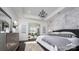 Spacious main bedroom with decorative chandelier, accent wall, and adjoined sitting room at 407 Newstyle Way, Gastonia, NC 28056