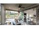 Relaxing screened-in patio features an outdoor dining area with backyard views and seamless transition to the living room at 407 Newstyle Way, Gastonia, NC 28056