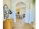 Elegant foyer features hardwood floors, arched doorways and neutral color palette at 409 Newstyle Way, Gastonia, NC 28056