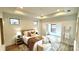 Cozy main bedroom with tray ceiling features hardwood floors and natural light at 409 Newstyle Way, Gastonia, NC 28056