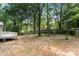 View of the backyard of the home featuring a spacious yard and deck at 410 Glass Ct, Kannapolis, NC 28081