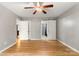 Bright bedroom featuring neutral paint, hardwood floors and sliding door to an ensuite bathroom at 410 Glass Ct, Kannapolis, NC 28081