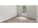 Small, gray bedroom with neutral carpet and a single window at 410 Glass Ct, Kannapolis, NC 28081