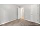 This bedroom features carpet, neutral paint, and an open doorway at 410 Glass Ct, Kannapolis, NC 28081