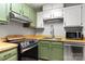 Modern kitchen with stainless steel appliances and updated countertops at 410 Glass Ct, Kannapolis, NC 28081