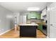 Well-lit kitchen with a central island and colorful cabinetry at 410 Glass Ct, Kannapolis, NC 28081