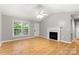 Bright living room with hardwood floors, fireplace, and large window at 410 Glass Ct, Kannapolis, NC 28081