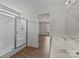 Bathroom featuring glass shower, double sinks, and wood-look floors, offering a functional and stylish space at 423 Courtland Ct, Kannapolis, NC 28081
