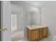 Bathroom features a light wood vanity with white countertop and a decorative light fixture at 423 Courtland Ct, Kannapolis, NC 28081
