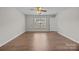 Expansive bedroom with ceiling fan, wood-look floors and natural light, offering a serene and comfortable retreat at 423 Courtland Ct, Kannapolis, NC 28081