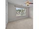 Bright bedroom features neutral carpet, ceiling fan, and a large window allowing natural light at 423 Courtland Ct, Kannapolis, NC 28081