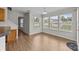 Bright breakfast nook with lots of windows and wood-look flooring at 423 Courtland Ct, Kannapolis, NC 28081