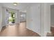 Welcoming entryway with wood-look flooring and view to the living area at 423 Courtland Ct, Kannapolis, NC 28081