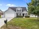 Charming single-Gathering home with a well-kept lawn, garage, and a welcoming entrance perfect for suburban living at 423 Courtland Ct, Kannapolis, NC 28081