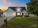 Charming single-Gathering home with a well-kept lawn, garage, and a welcoming entrance perfect for suburban living at 423 Courtland Ct, Kannapolis, NC 28081