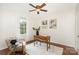 Bedroom featuring a desk with hardwood floors, a ceiling fan, and a cozy chair at 4329 Hathaway St # D, Charlotte, NC 28211