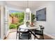 Bright dining space with backyard views, a round table, and modern decor at 4329 Hathaway St # D, Charlotte, NC 28211