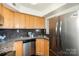 Well-maintained kitchen featuring stainless steel appliances and ample maple cabinet space at 4329 Hathaway St # D, Charlotte, NC 28211